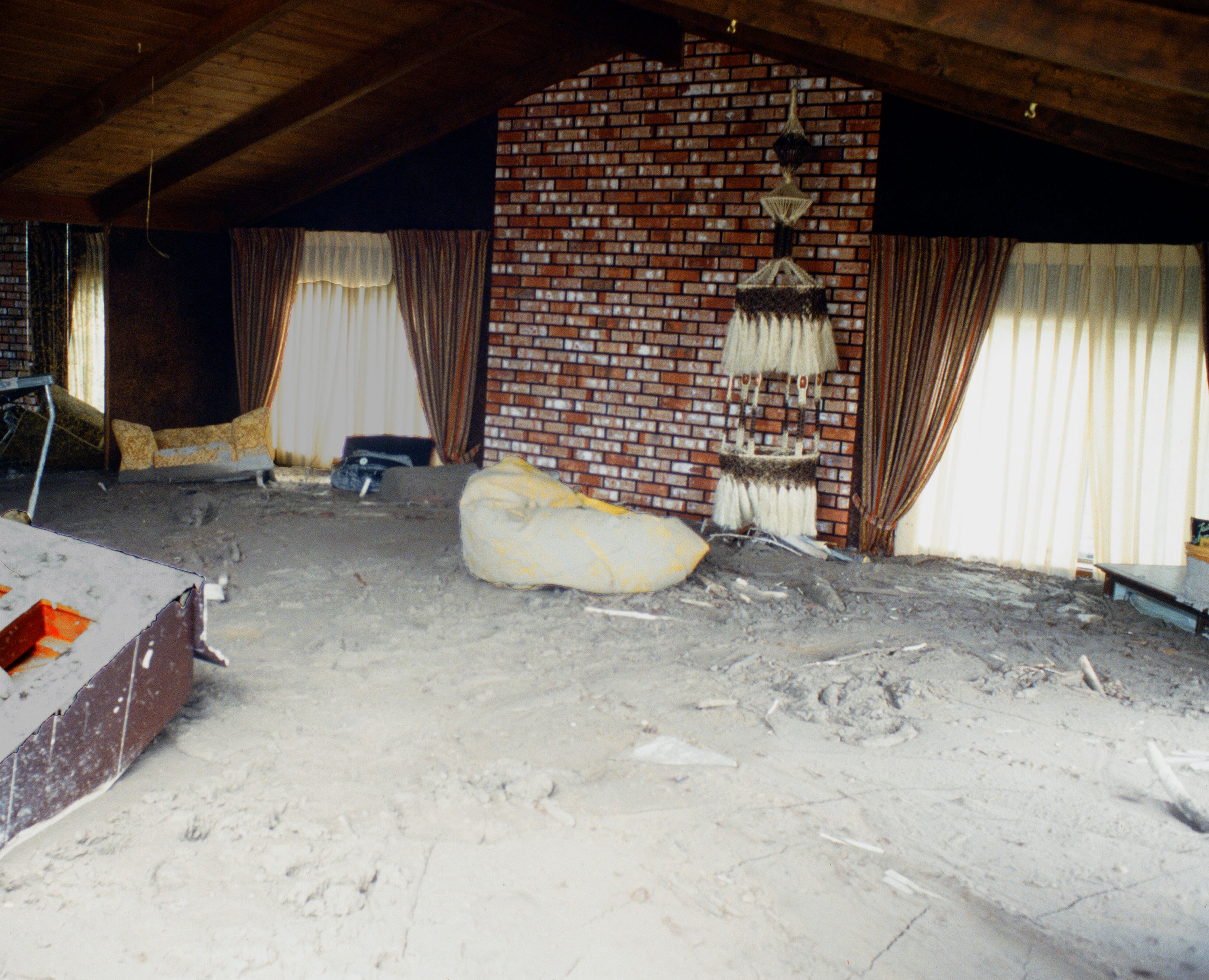 interior of home filled with mud or ash